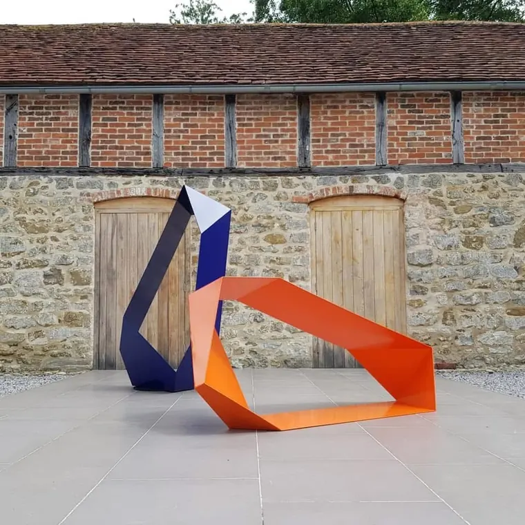 Orange and navy contemporary steel sculpture coated by Hereford Coatings